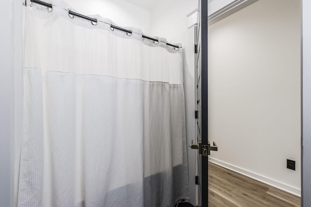 bathroom featuring hardwood / wood-style flooring