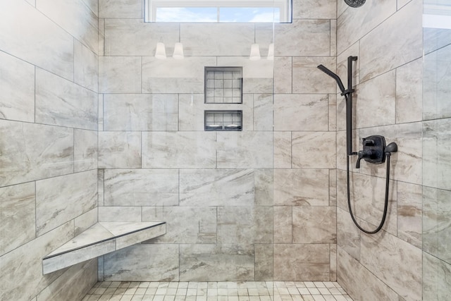 bathroom featuring a tile shower