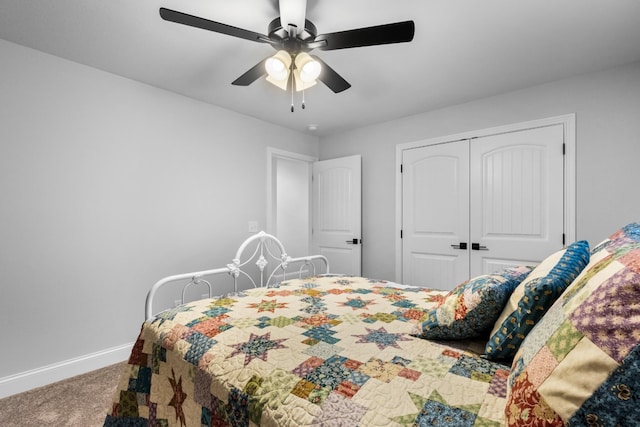 carpeted bedroom with a closet and ceiling fan