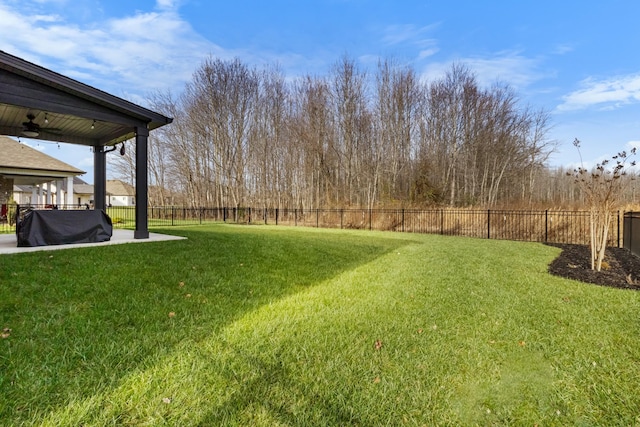 view of yard with ceiling fan