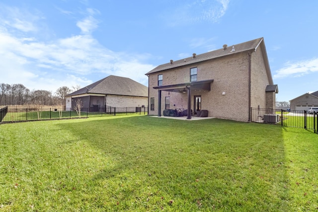 back of house featuring central AC, a yard, and a patio