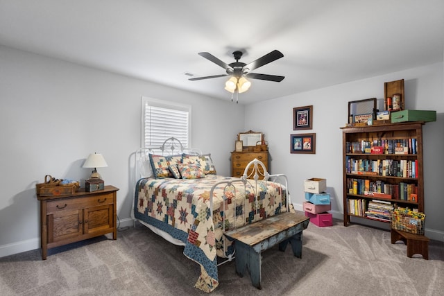 bedroom with ceiling fan and light carpet