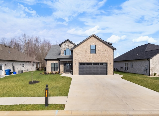 view of front of property featuring a garage, a front yard, and central AC