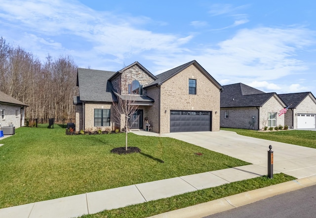 view of front of house featuring a front lawn, a garage, and central AC