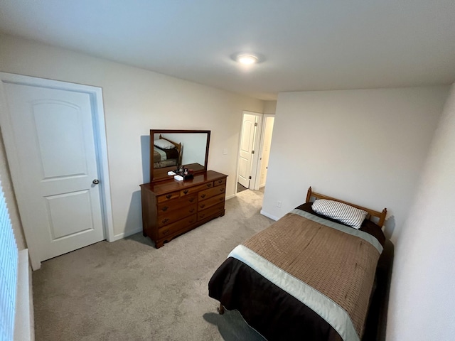 bedroom featuring light carpet