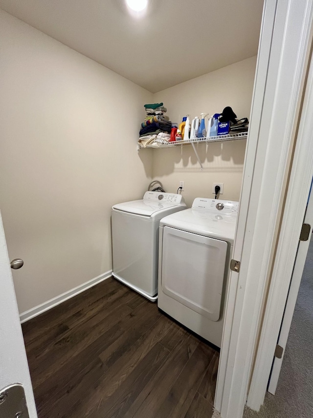 laundry room with dark hardwood / wood-style flooring and independent washer and dryer