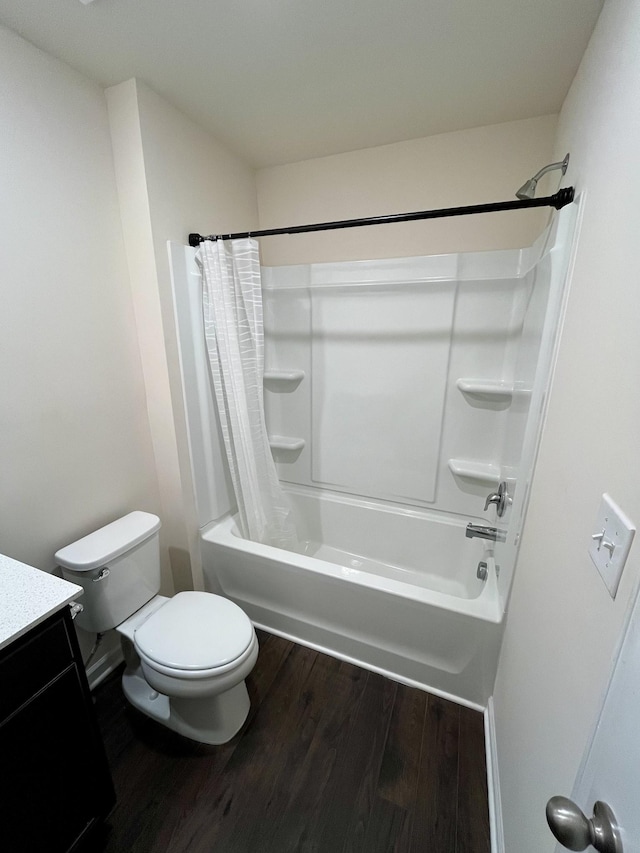 full bathroom featuring vanity, wood-type flooring, shower / tub combo, and toilet