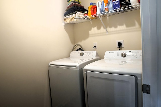washroom with laundry area and washing machine and clothes dryer