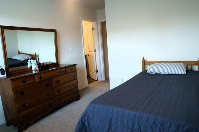 bedroom with light carpet