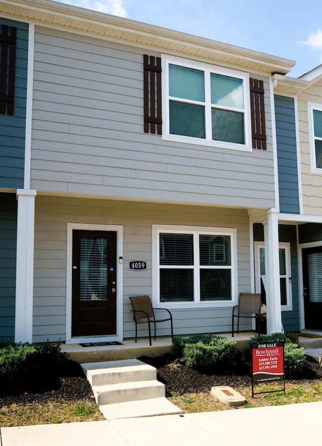 view of property featuring a porch