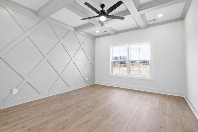 empty room featuring beam ceiling, ceiling fan, light hardwood / wood-style floors, and coffered ceiling