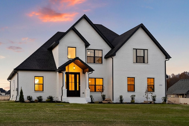 view of front of home featuring a yard