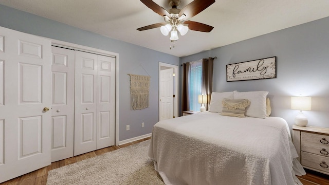 bedroom featuring ceiling fan, a closet, and hardwood / wood-style floors