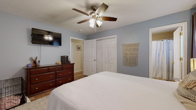 bedroom featuring hardwood / wood-style floors, ceiling fan, and a closet