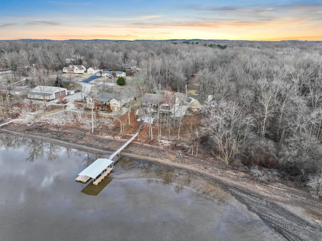 aerial view at dusk with a water view