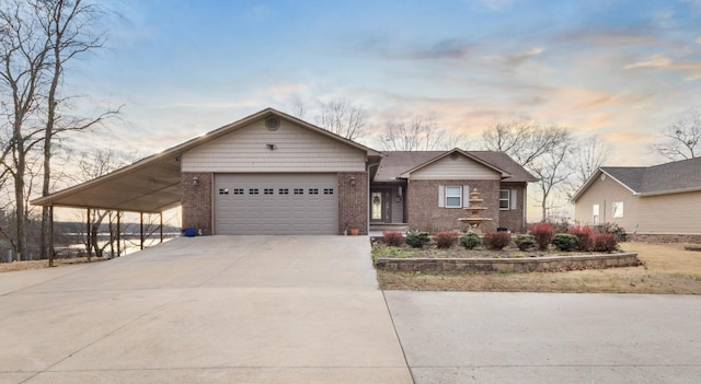 view of front facade featuring a carport and a garage