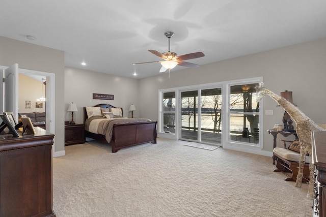 bedroom with access to exterior, ceiling fan, and light carpet