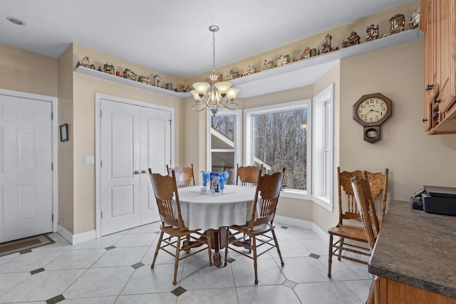 dining space with an inviting chandelier