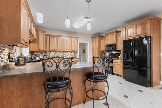 kitchen with black appliances, decorative backsplash, light tile patterned floors, and kitchen peninsula