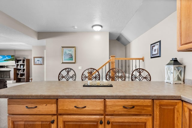 kitchen with kitchen peninsula and a textured ceiling