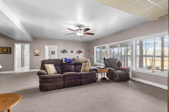 living room with carpet and ceiling fan