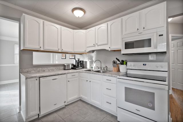 kitchen featuring white cabinetry, white appliances, and sink