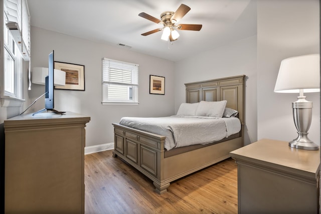 bedroom featuring ceiling fan and light hardwood / wood-style floors