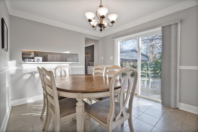 tiled dining area with a chandelier and ornamental molding