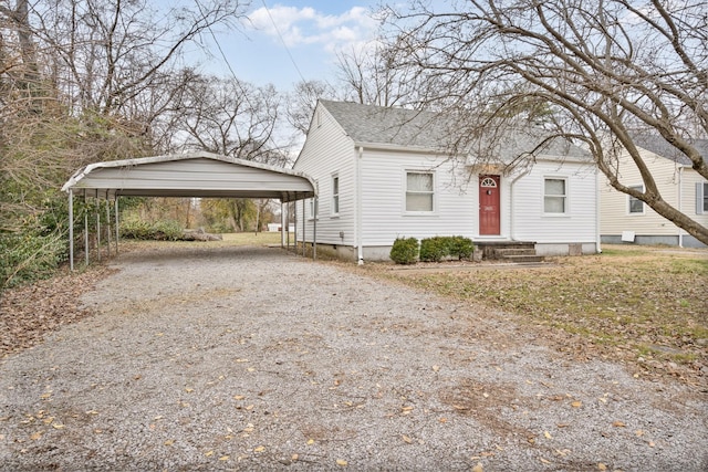 bungalow-style home with a carport