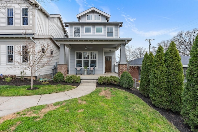 view of front of house with a front lawn and covered porch