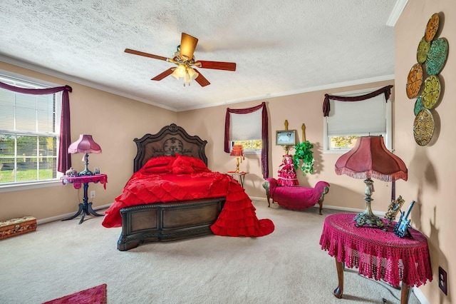 carpeted bedroom with ceiling fan, crown molding, and a textured ceiling