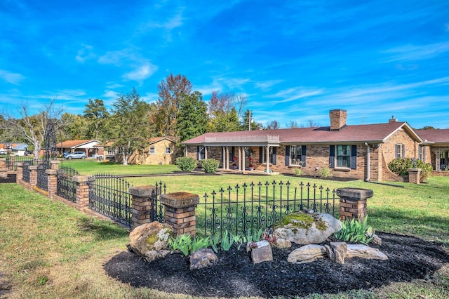 back of property featuring a lawn