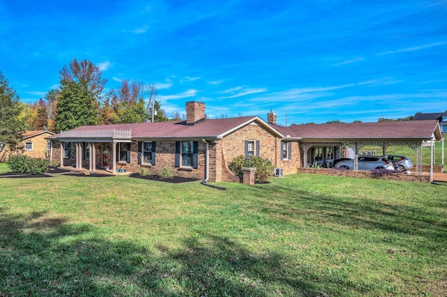 single story home featuring a carport and a front lawn