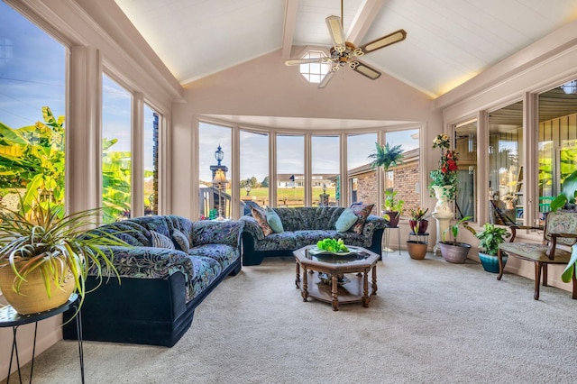 sunroom with vaulted ceiling with beams and ceiling fan