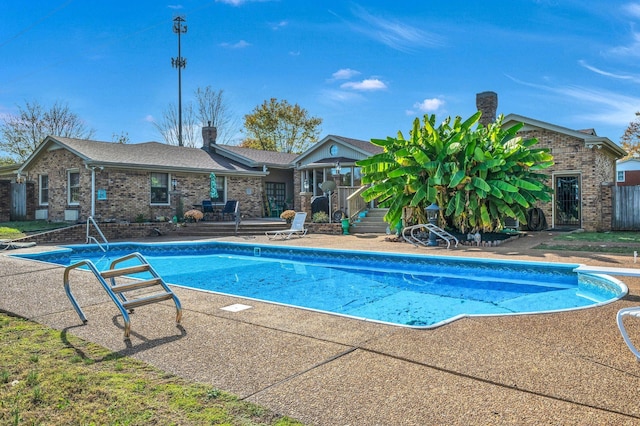 view of pool featuring a patio area