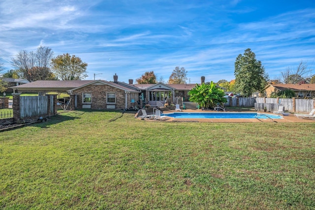 view of yard with a fenced in pool