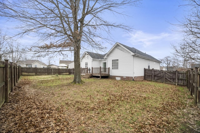 back of house featuring a deck