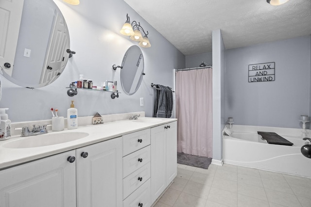 bathroom with vanity and a textured ceiling