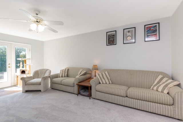 carpeted living room featuring ceiling fan