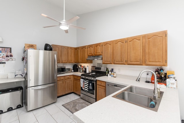 kitchen featuring sink, stainless steel appliances, high vaulted ceiling, and tasteful backsplash