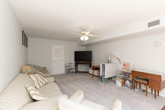 living room featuring ceiling fan and light carpet