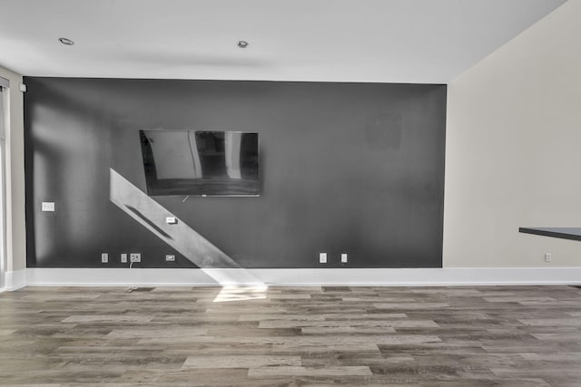 unfurnished room featuring hardwood / wood-style floors