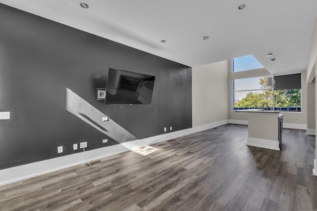 unfurnished living room with hardwood / wood-style floors