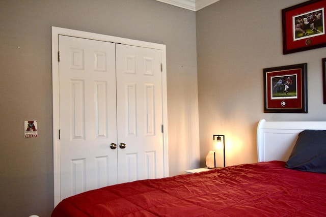 bedroom featuring a closet and ornamental molding