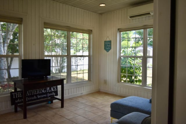 sunroom featuring a wall mounted air conditioner