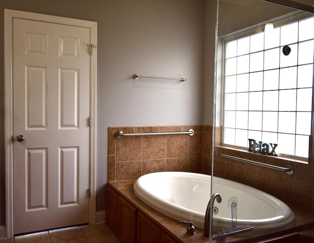 bathroom featuring tile patterned floors and a bathtub