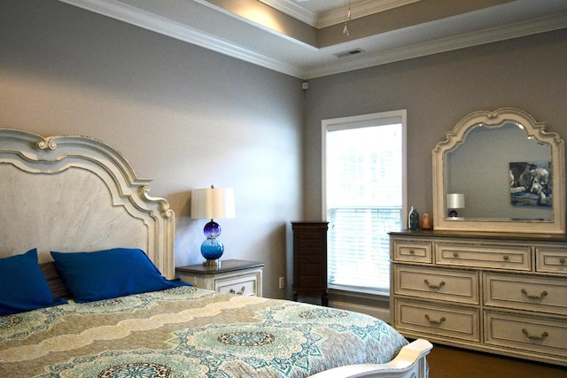 bedroom with crown molding