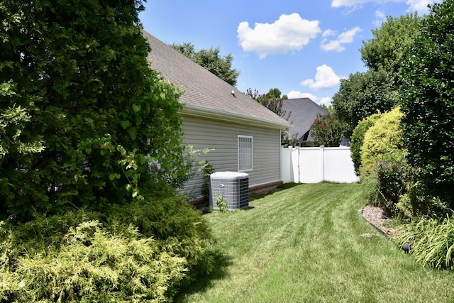 view of yard featuring central air condition unit