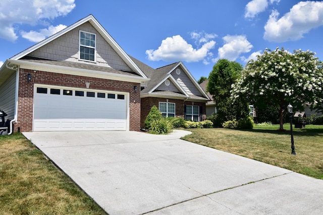 view of front of home with a garage and a front lawn