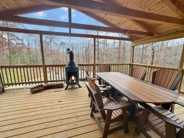 deck featuring exterior fireplace